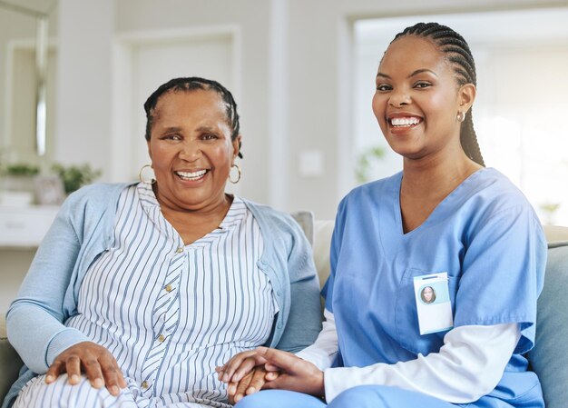 senior woman nurse holding hands portrait support healthcare happiness retirement home elderly black person caregiver together trust elderly care help with homecare 590464 185990.jpg
